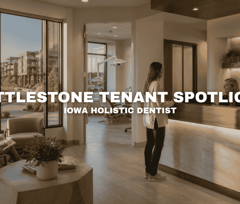 Interior of a modern dental office at Kettlestone Lakes in Waukee with a warm reception desk, treatment room, waiting area, and large windows overlooking the lakeside mixed-use development.
